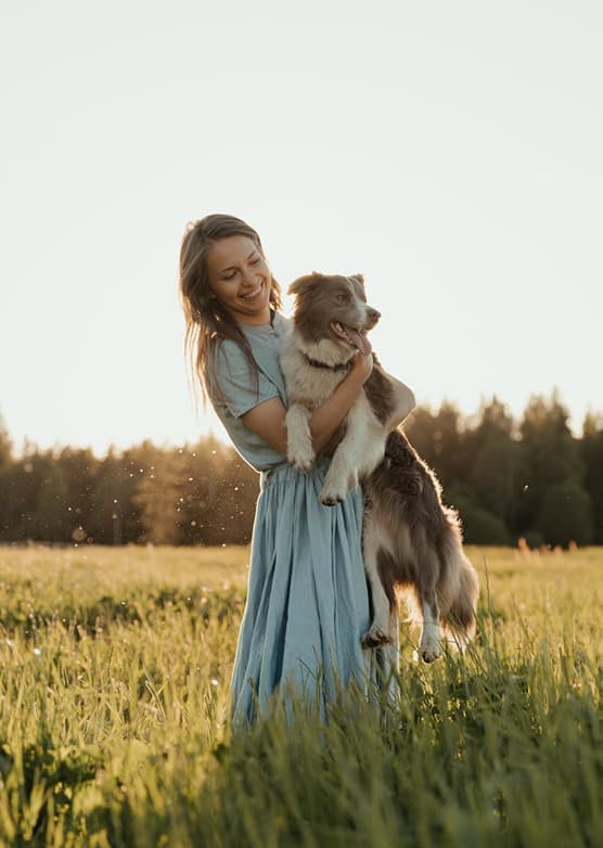 Pet sitter holding a dog